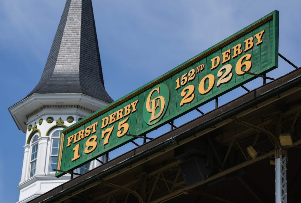 Churchill Downs employees Corey McGreal and Todd Herl work to update the iconic green Kentucky Derby sign above the Grandstand to reflect the 152nd Running of the Kentucky Derby. April 1, 2026.